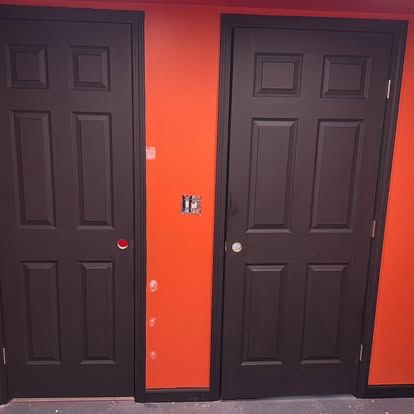 Interior closet doors finished in bold orange paint